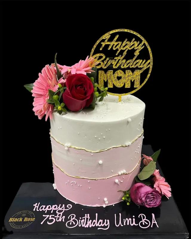 Pink ombre cake topped with fresh flowers