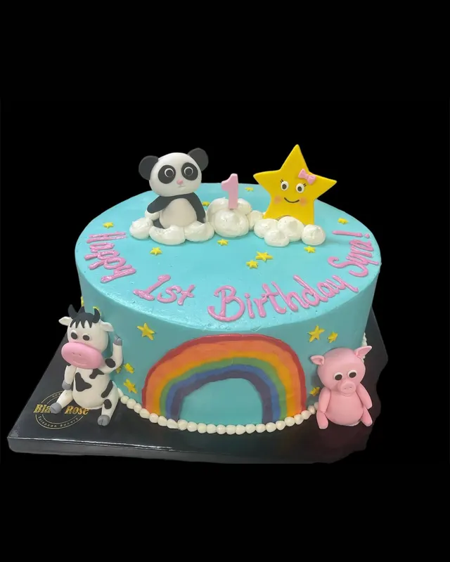 Turquoise first birthday cake with panda and rainbow
