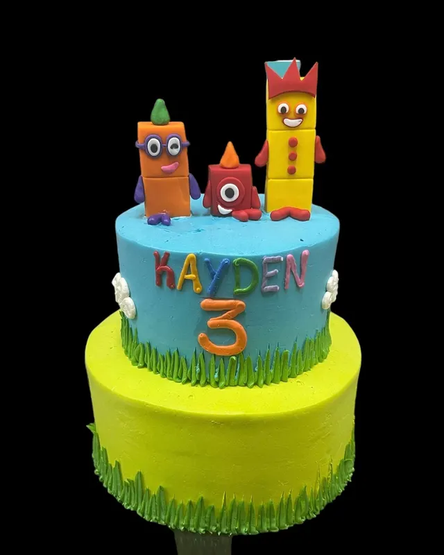 Colorful two-tier third birthday cake